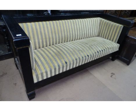 An Austrian secessionist sofa circa 1900, ebonised and gilt decorated wood frame with panelled ends, decorated in the manner 