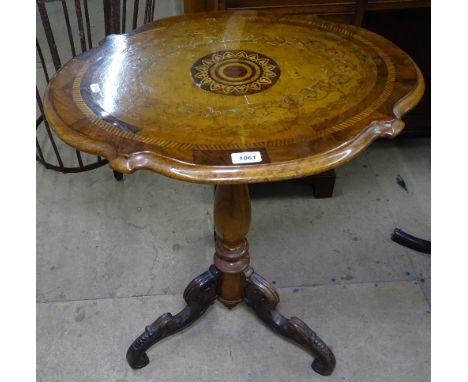 A Victorian walnut occasional table, the shaped top with inlaid decoration, raised on a carved tripod base, W62cm, H72cm