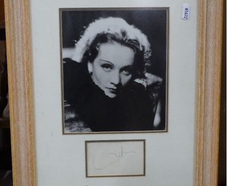 A crayon's portrait of Omar Sharif, and a photograph of Marlene Dietrich. signed