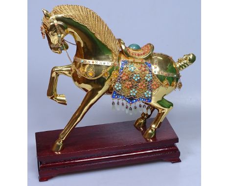 A Chinese gilded silver ornamental horse, with filigree mane and applied jade, coral and turquoise stones, on wooden stand, o