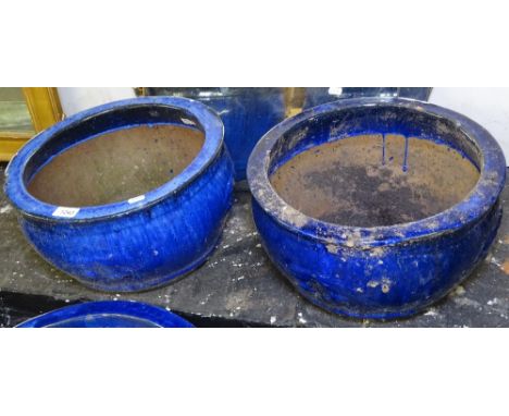 A pair of blue glazed ceramic planters, W39cm, H25cm