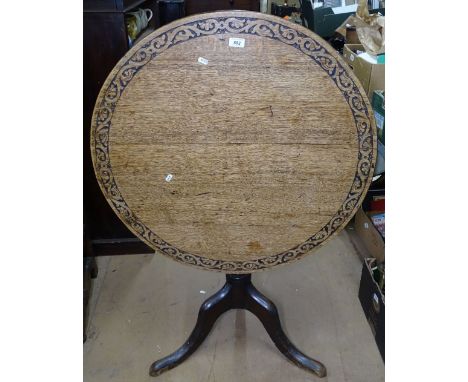 A Victorian carved oak tilt-top table, on tripod base, W81cm