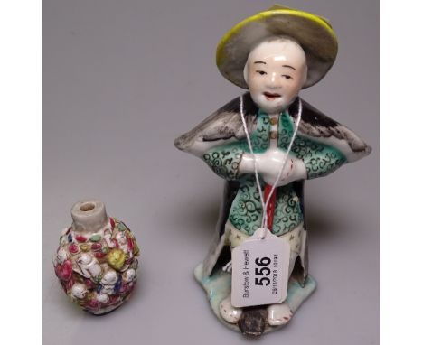 A Chinese figure with a walking stick, 6", and a Chinese porcelain snuff bottle