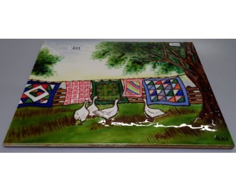 A ceramic tile wall plaque depicting geese and washing line with tube lined decoration, length 14" 