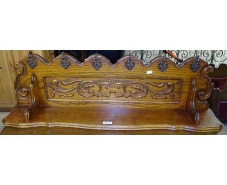 A French carved and panelled oak hanging hat / coat rack, W100cm