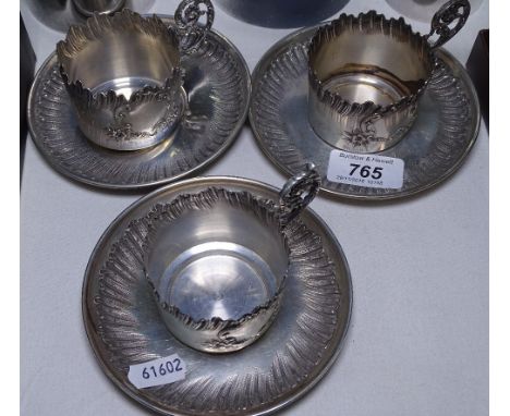 A set of 3 Continental silver coffee cups and saucers, with embossed decoration, marked 800, 11.7oz