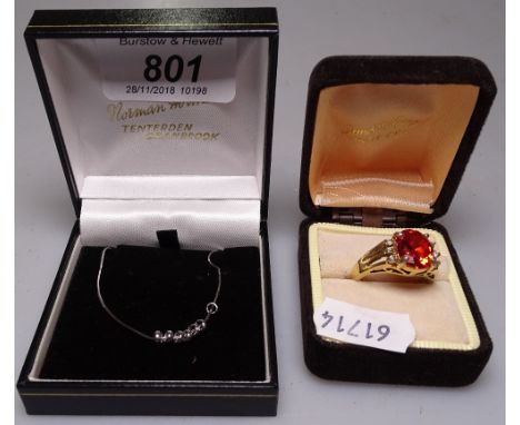 A 9ct white gold chain and a silver gilt stone-set ring