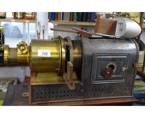 An Antique brass-mounted magic lantern, and a stereo viewer