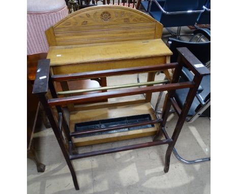 An Arts and Crafts oak stick stand, and an Edwardian mahogany towel rail