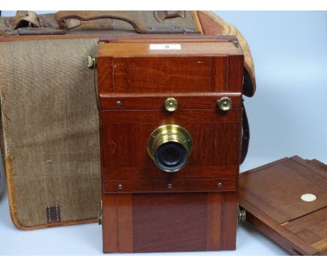 A good quality 19th century mahogany and brass mounted plate camera, stamped DRGM, with mahogany plates and canvas bag
