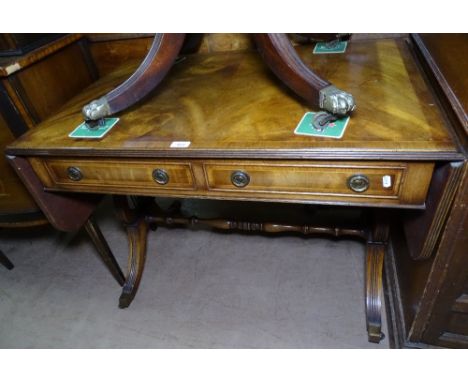 A reproduction cross-banded mahogany sofa table, with 2 frieze drawers, raised on lyre end supports, W91cm