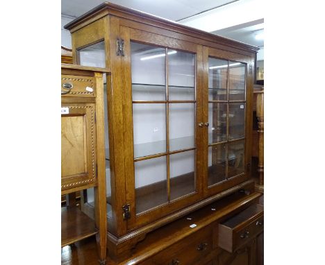 A good quality reproduction oak display cabinet, with 2 lattice glazed doors, on bracket feet, W120cm