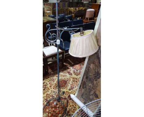 A painted metal standard lamp and shade