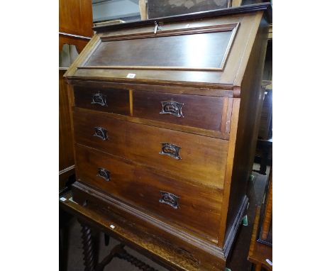 An Art Nouveau mahogany bureau, the panelled full front revealing a fitted interior, with 2 short and 2 long drawers under, b