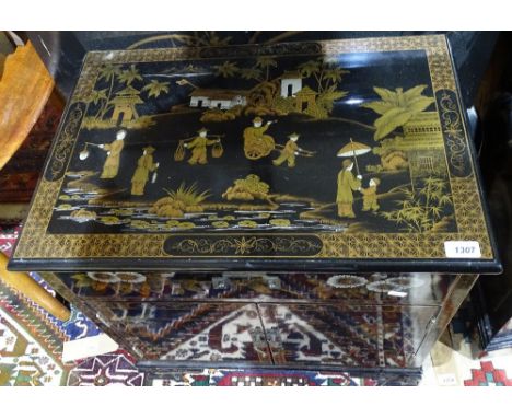 A Chinese black lacquered low cabinet, with drawer and cupboards, bracket feet and chinoiserie decoration, W60cm, H60cm