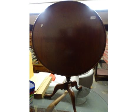 A mahogany tilt-top table, with dish top on tripod base, W68cm
