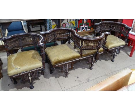 A Moorish design bone and mother-of-pearl inlaid conversation seat, together with a pair of matching corner elbow chairs
