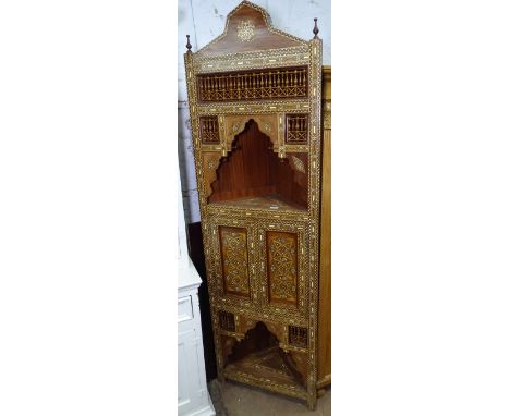 A Moorish design bone and hardwood inlaid corner cabinet, with panelled cupboard doors, W60cm