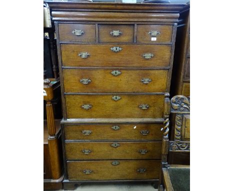 A George III oak chest on chest, the top fitted with an Ogee frieze drawer with 3 short and 3 further long drawers below, wit