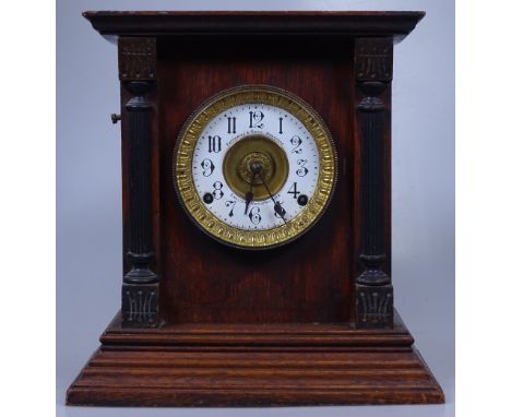 A Victorian oak-cased mantel clock by Fattorini &amp; Sons of Bradford, with postman's alarm movement, height 13.5"