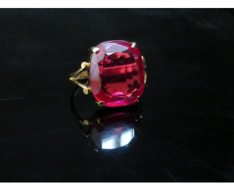 A gold ring with oriental markings, with large red stone, 4.9g 