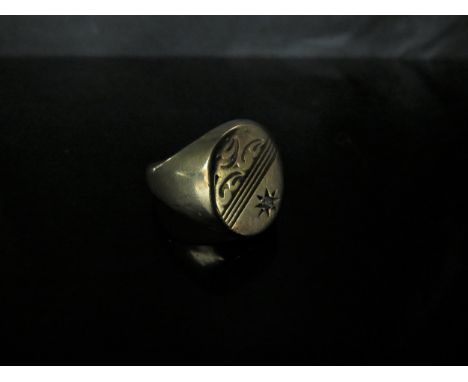 A 9ct gold signet ring, half engraved, set with a small diamond in star setting. Size V, 6.2g 