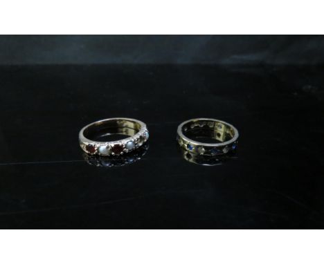 A 9ct gold sapphire and clear stone eternity ring and a garnet and pearl ring (one garnet missing) stamped 9ct, 3.9g 