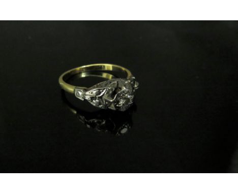 An unmarked gold and platinum set diamond solitaire ring 0.20ct approx diamond in illusion setting, in high mount. Size Q, 3.