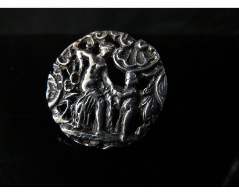 A silver ring made from a button depicting female and putto, 3.3cm diameter. Size N, 7.3g 