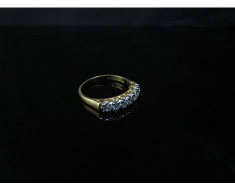 An 18ct gold diamond seven stone ring approx 0.50ct total. Size O, 3.2g 