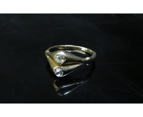 A gold ring with two old cut diamonds in North/South setting, unmarked. Size M, 3.9g 