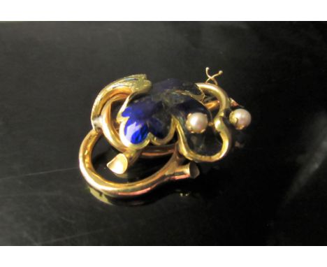 A gold enamelled foliate scroll brooch, enamel a/f, with two pearls, stamped 18k, 12.5g 