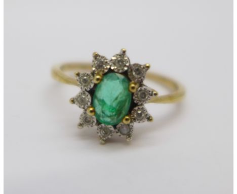 A 9ct gold, diamond and emerald ring, 2.1g, P