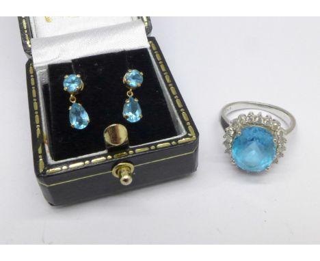 A 9ct white gold, topaz and diamond ring and a pair of blue stone earrings, ring 5g, M