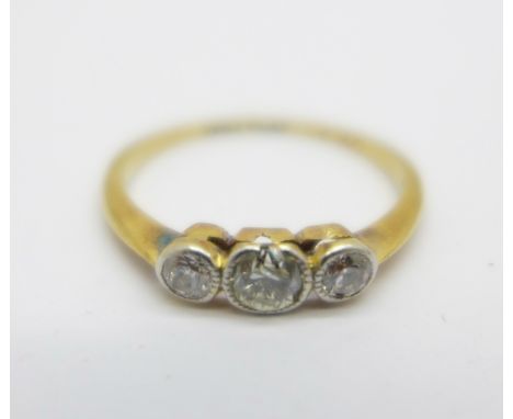 An 18ct gold ring with three diamonds, 1.5g, K