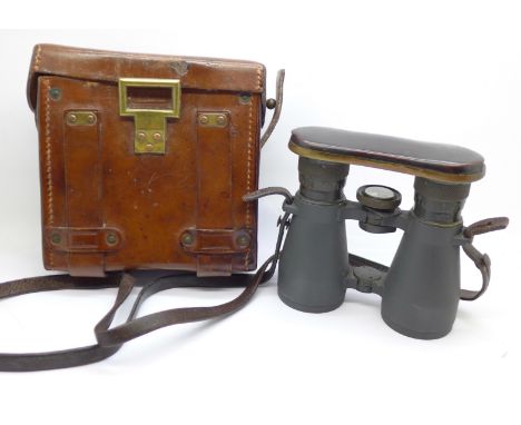 A pair of German WWI period binoculars with integral compass, cased, the case marked Emil Busch A.G., Rathenow