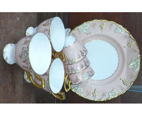 A Royal Crown Derby six setting Vine coffee set, six cups, saucers and a plate