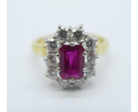 An 18ct gold, ruby and diamond cluster ring, stamped 1.05ct diamond, 6.75g, P