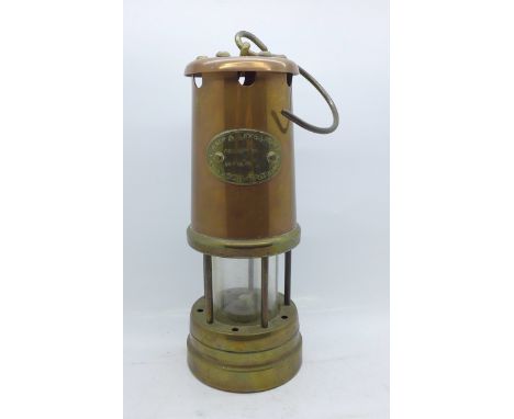 A Lamp and Limelight brass miner's safety lamp