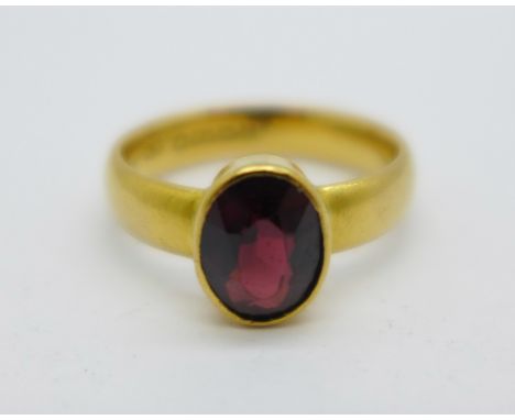 A 22ct gold and garnet ring, 5.9g, N