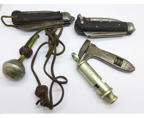 Two WWII Army issue pocket knives, a whistle, spanner and plumb line