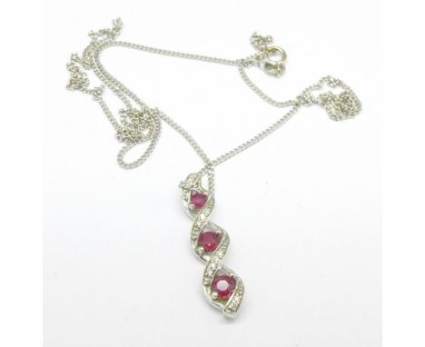 A 9ct white gold, diamond and ruby drop pendant, 3.8g