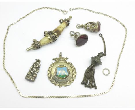A Victorian hallmarked silver seal fob, one other fob, a silver and enamel cricket fob, etc.