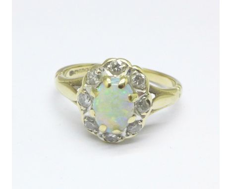 A 9ct gold, diamond and opal ring, 2.5g, J