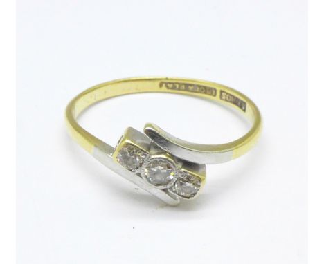 An 18ct gold, platinum set three stone diamond ring, 2.3g, P