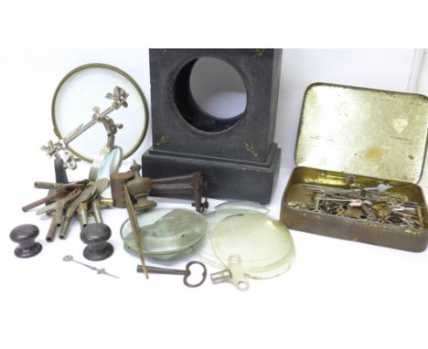 Clock keys, a clock case, glasses and hands