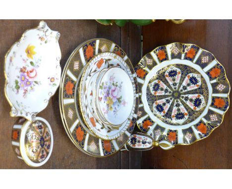 A collection of Royal Crown Derby including a pair of 1128, 21cm plates, an 1128 wavy edged plate, an 1128 candle snuffer and