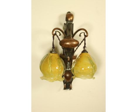 AN ARTS AND CRAFTS ANODISED COPPER WALL LIGHT, early 20th century, the shaped plain oblong plaque with planished and cut sinu