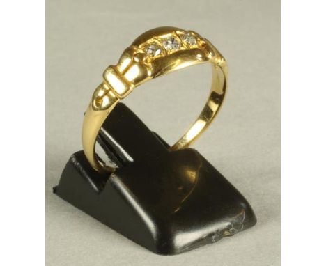 A VICTORIAN THREE STONE DIAMOND RING, the old brilliants gypsy set to a chased panel and plain shank, size R