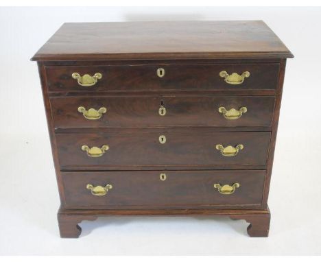 A GEORGIAN MAHOGANY CHEST, early 19th century, the moulded edged top over four graduated cockbeaded drawers with brass drop h